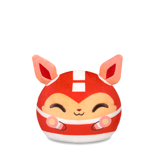 A round, stuffed toy resembling a fox, wearing a red costume with closed eyes and a smiling expression. This adorable Capcom Plushiverse Mega Man and Rush 4