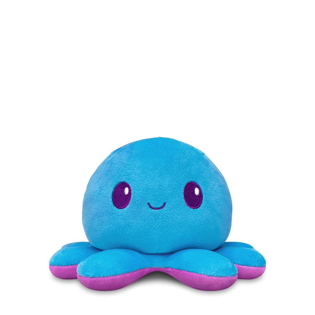 A Plushiverse Indigo Octo 4" Reversible Plushie from the TeeTurtle collection, featuring a smiling face, large purple eyes, and a pink underside. This adorable reversible plushie makes a perfect stuffed toy for any age!