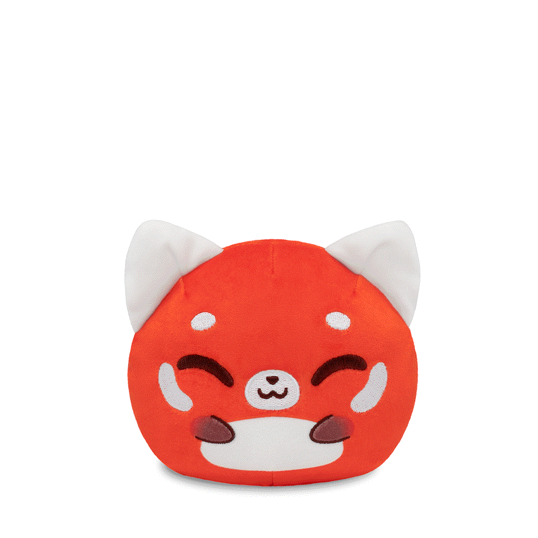 The Plushiverse Panda Pals 4" Reversible Plushie by TeeTurtle is a soft and cuddly, round plush toy featuring a smiling red panda with white ears, blush marks, and visible paws on its face.