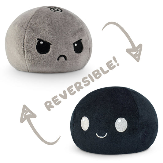 A TeeTurtle Reversible Ball Plushie (Gray + Black) with the words