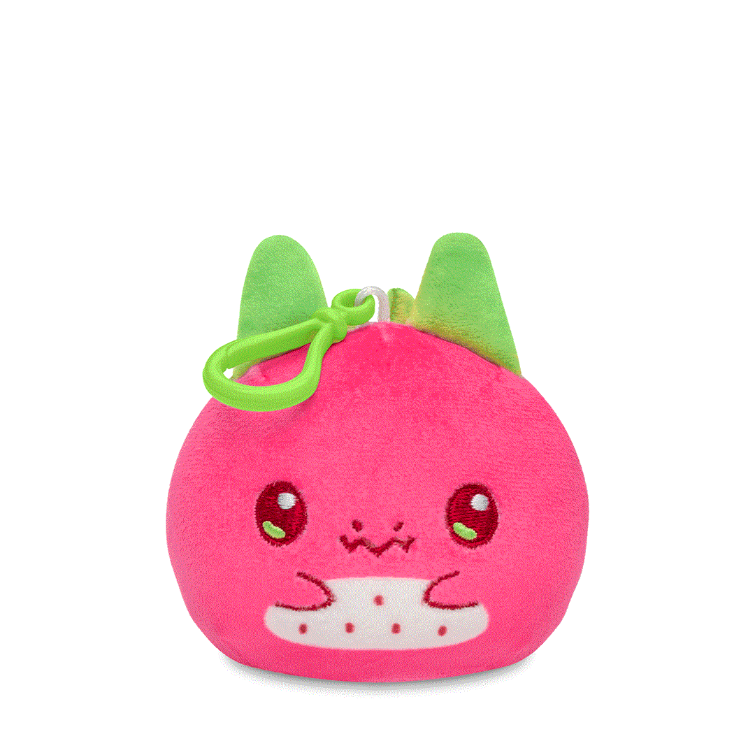 Pink Plushiverse Dragonfruit Reversible Plushie Keychain shaped like a cute strawberry with a smiling face and green leaves on top, featuring a backpack clip, isolated on a white background by TeeTurtle.