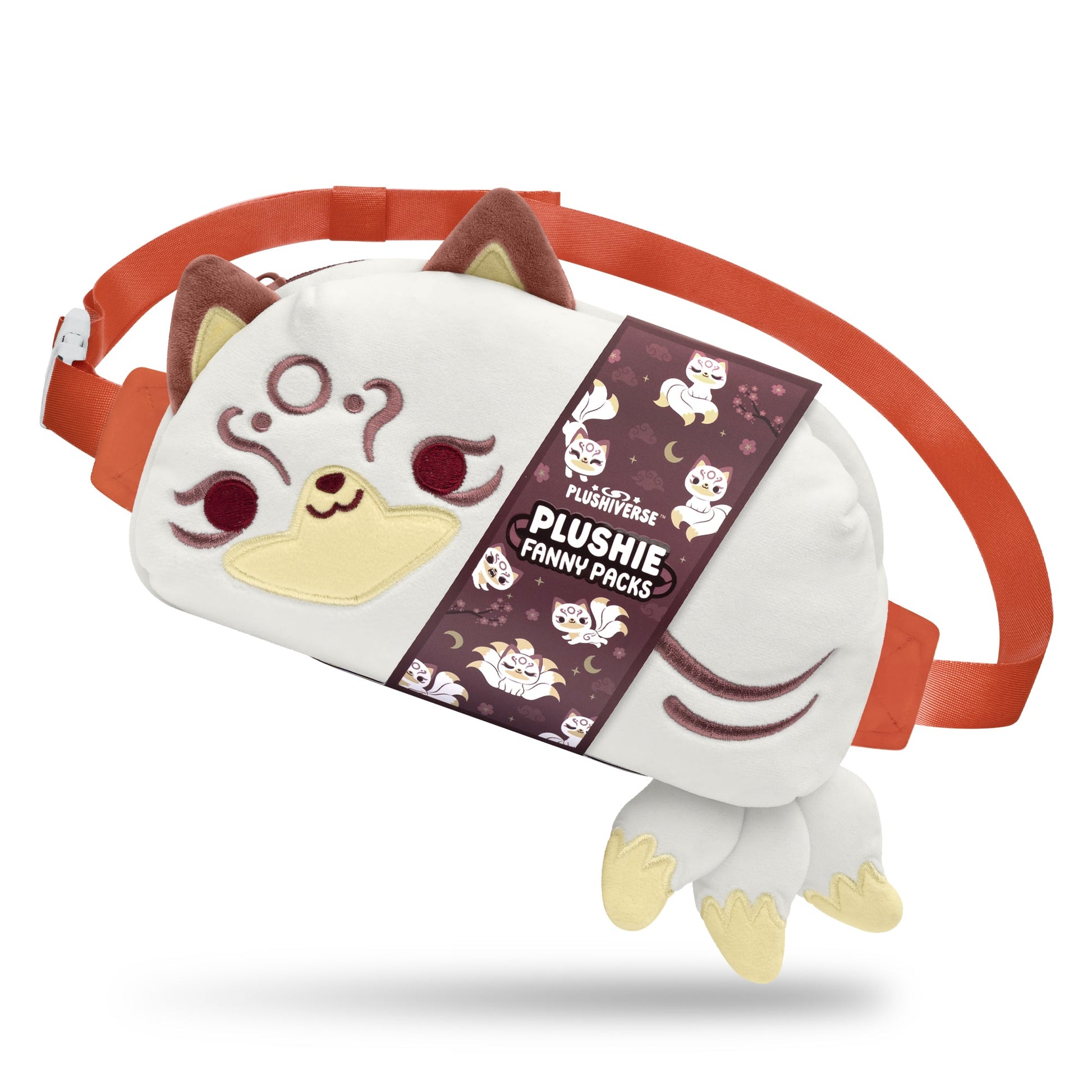 A white plush fanny pack with cat-like features, brown and yellow accents, and an adjustable orange belt strap. Part of the "Myths & Cryptids" collection, the packaging reads "Plushiverse Magical Kitsune Fanny Pack by TeeTurtle.